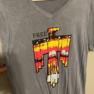 Free bird short sleeve soft tee. Has a minimal acid wash look. Long length.